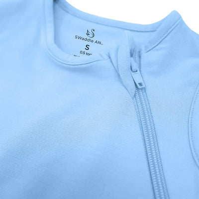 Close-up of a light blue baby swaddle with a zipper and 'Swaddle AN' branding.