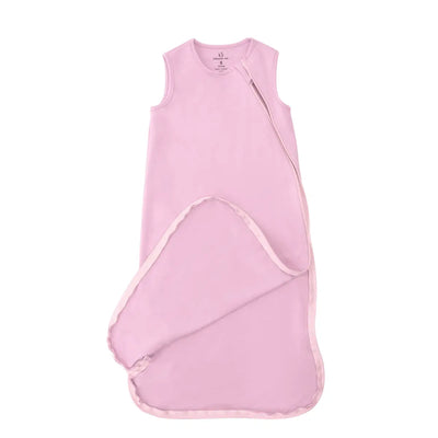 Pink baby sleeping bag on a white background