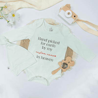 Baby onesie with text on a white background