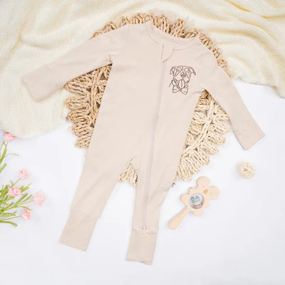 Beige baby outfit with floral design on a white background