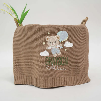 Personalized Teddy Bear Baby Blanket is more than a cozy layer; it’s a dreamy sky scene, where a sweet bear and your baby’s name float among the clouds, ready to drift off to sleep together.