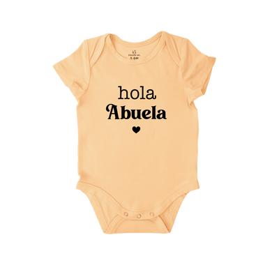 Beige baby onesie with 'Hola Abuela' text on a white background