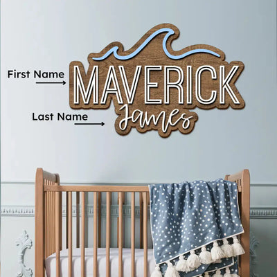 Wooden name sign with customizable names above a crib in a nursery setting
