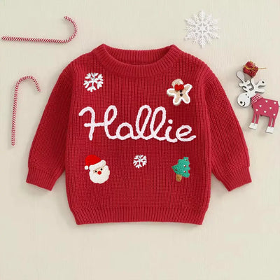 Red sweater with Christmas-themed designs and the name 'Hallie' on a beige background