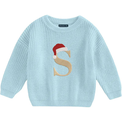 Light blue sweater with a letter 'S' and Santa hat design on a white background