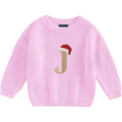 Pink sweater with a letter 'J' design on a white background