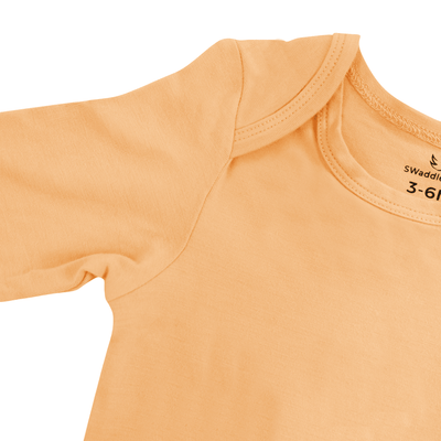 Long Sleeve Baby Bodysuit - Peach Fuzz SwaddleAn