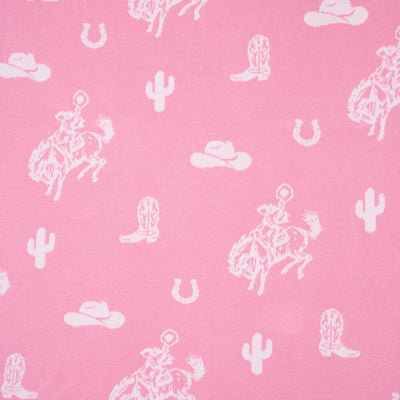 Western-themed pattern with horses, boots, hats, and cacti on a pink background