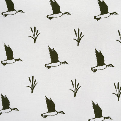 Pattern of black birds and reeds on a white background