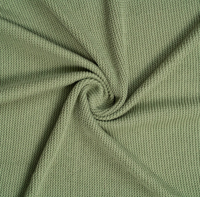 Close-up of green fabric with a swirl pattern