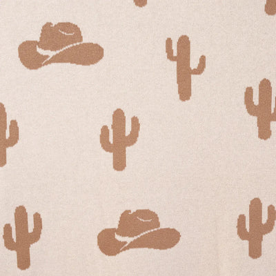Pattern of cowboy hats and cacti on a beige background