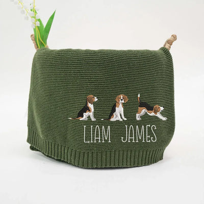 Forest green personalized baby blanket with embroidered beagle puppies and text on a white background