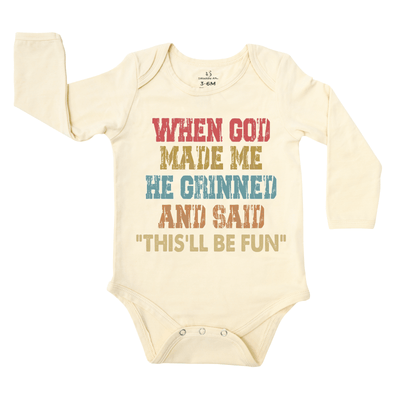 Baby onesie with colorful text on a white background
