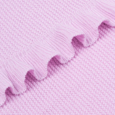 Close-up of lilac ruffle knitted baby blanket with a textured pattern