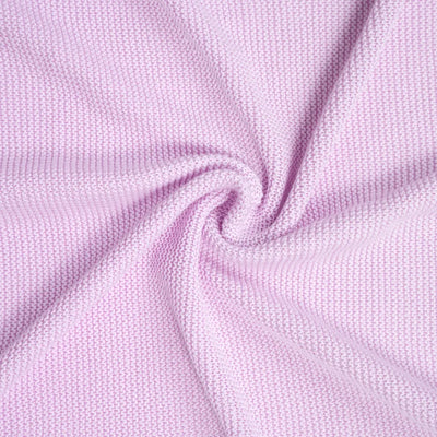 Close-up of lilac ruffle knitted baby blanket with a subtle texture