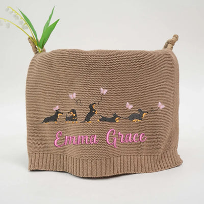 Mocha personalized baby blanket with embroidered dachshunds design and 'Emmie Grace' text on a white background