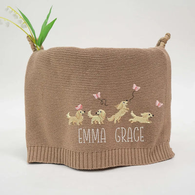 Mocha personalized baby girl blanket with embroidered dachshunds and 'Emma Grace' text on a white background