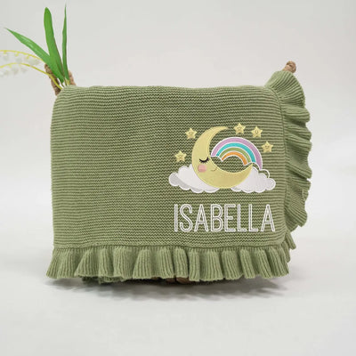 Sage green personalized baby blanket with embroidered moon and stars design and name 'Isabella' on a white background