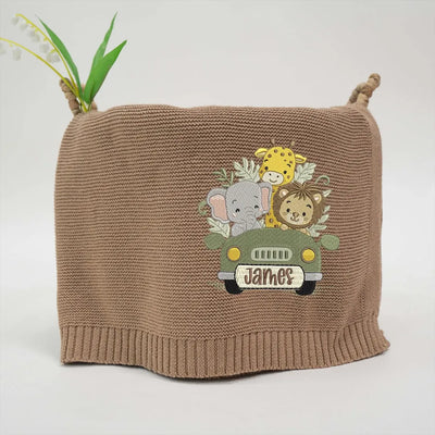 Mocha personalized baby blanket with embroidered woodland adventure awaits and 'James' on a white background