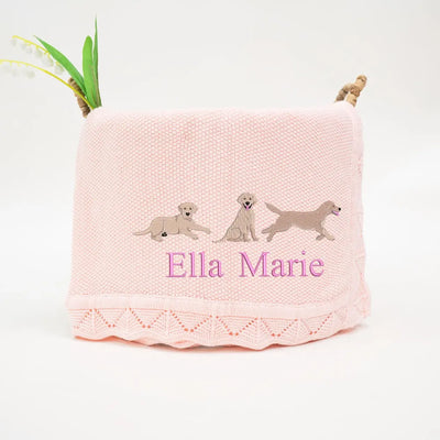 Pink personalized baby blanket with embroidered labrador retrievers and 'Ella Marie' text on a white background